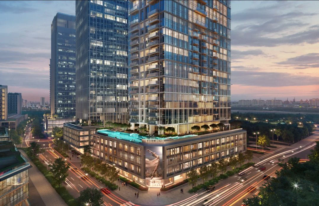 Phối cảnh ban đêm của khối đế thương mại The Opusk Residence với ánh sáng rực rỡ và hồ bơi trên cao.