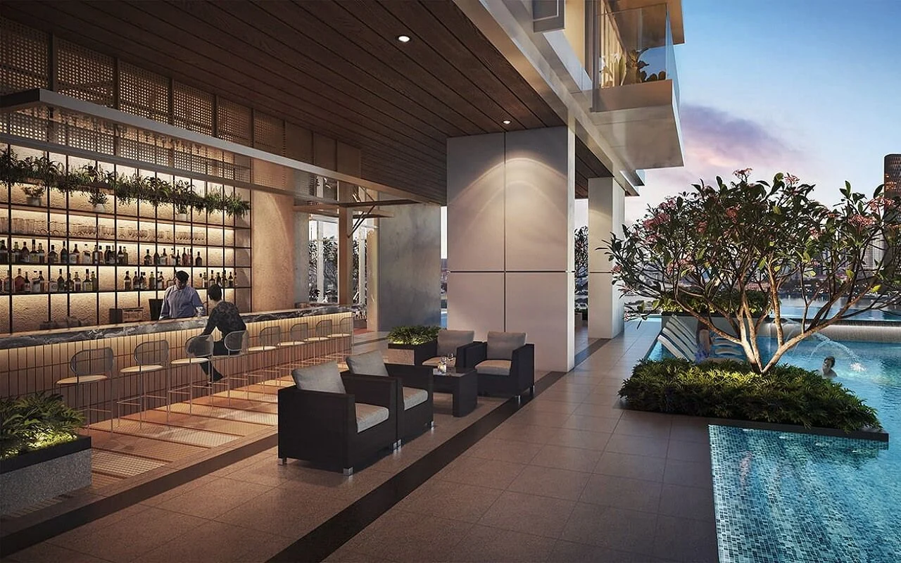 Quầy bar ngoài trời cạnh hồ bơi với ghế ngồi và cây xanh tại The Opusk Residence.